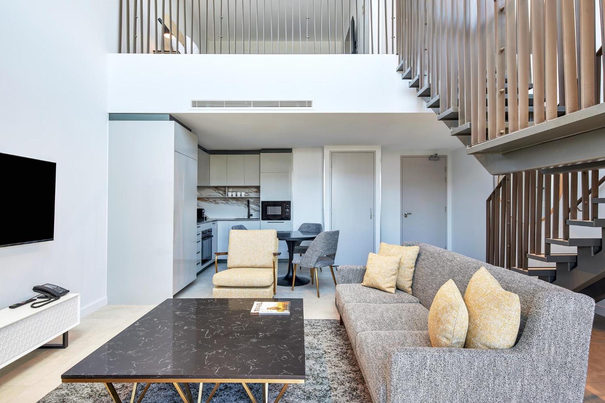 Meriton Suites Canberra Ngoại thất bức ảnh The interior of a duplex apartment